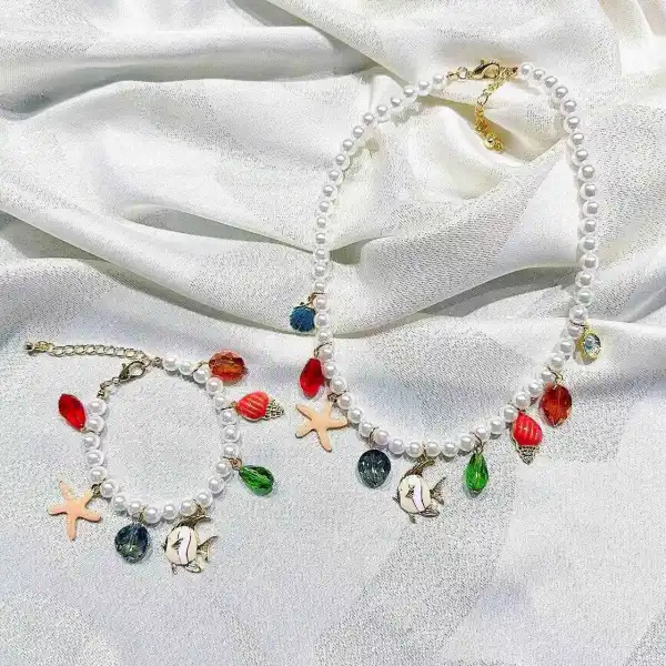 Ensemble des bijoux 
collier et bracelet 
en fausses perles  | Les Élixirs Parfumés